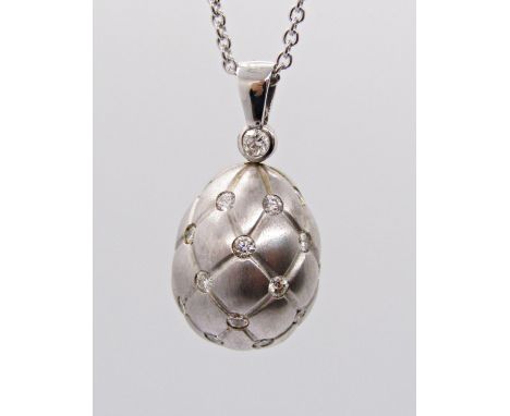 Fabergé Treillage 18ct white gold egg pendant necklace, the diamond set pendant with quilted finish, bale stamped '2707/2', 9