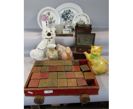 A miscellaneous collection of items including a pair of Staffordshire style spaniels, a cat teapot, a duck storage box, bird 