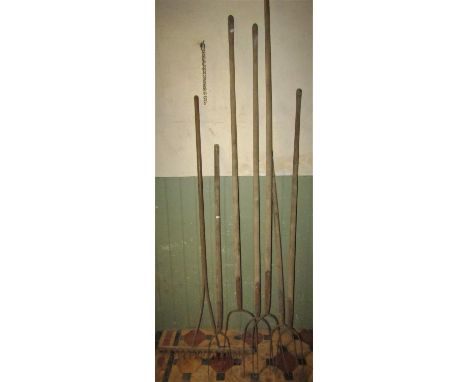 Six vintage long wooden handled hay/pitchforks together with a wooden rake (7) 