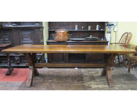 A Banks of Bristol good quality old English style refectory table with heavy plank top, raised on a pair of X shaped supports