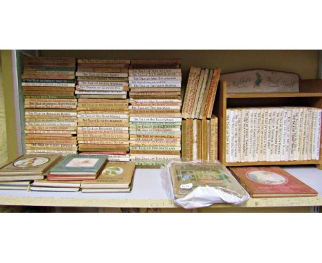 A Peter Rabbit book shelf containing various Beatrix Potter books, together with an extensive collection of further Beatrix P