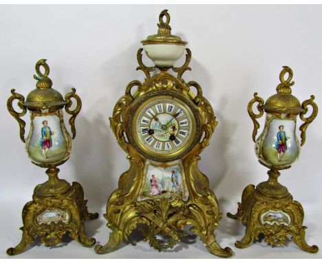 A 19th century French clock garniture with gilded finish porcelain panels and eight day striking movement 