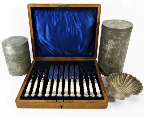 A good selection of silver plated items including a circular salver raised on cabriole legs, a scalpel shell, a stack of coas