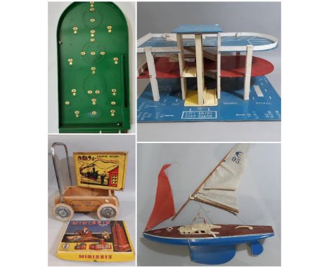 Vintage toys including 'Giner' pond yacht, large multi levelled toy garage, (both for restoration), a Triang Baby Walker, Cha