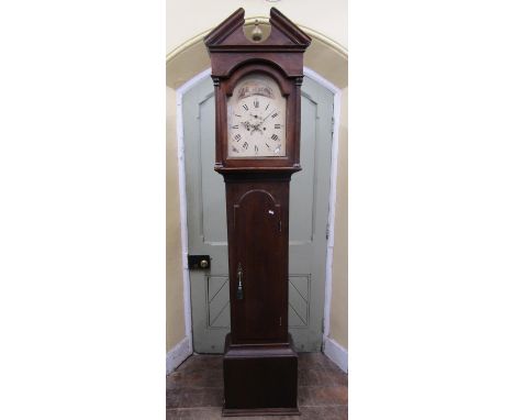 A Georgian oak longcase clock, the hood with architectural pediment enclosing a broken arch painted dial, with winter shootin