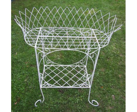 A Victorian style lattice wirework two tier garden/conservatory planter raised on simple scrolled supports, 70 cm long x 40 c