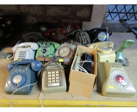 Thirteen assorted 1960s and 70s rotary and button telephones in various colours, some designed by Ericsson and two trim type 