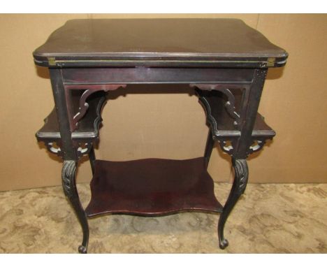 A small Edwardian mahogany foldover top card table, raised on scrolled cabriole supports, united by under tiers, 64cm wide x 