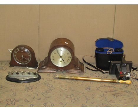 A box of miscellaneous items to include a pair of cased EWOE Russian binoculars polaroid camera ,pipe rack, mantle clock, Kil