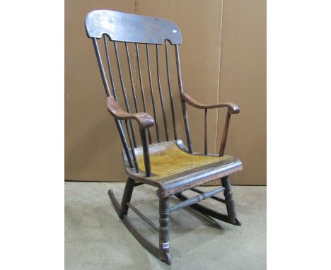 A Boston style rocking chair with slender stick back, scrolled arms and seat and original painted with stencilled finish 