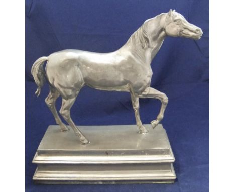 Large cast model of a horse in pewter on a pewter plinth38cm in length by 34cm high  Fine condition