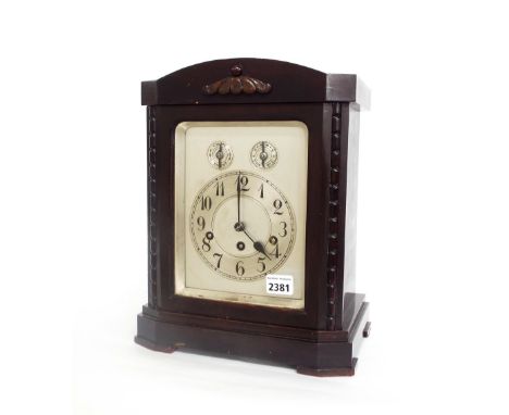 Mahogany three train bracket clock, the Junghans movement striking on four rods, the 6" silvered dial with subsidiary chime/s