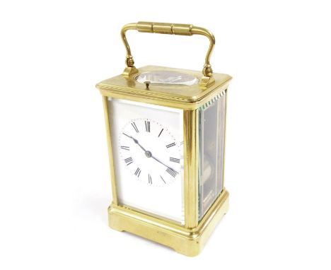 Repeater carriage clock with Jacot movement striking on a gong, within a corniche gilt brass case; also with outer Morocco tr