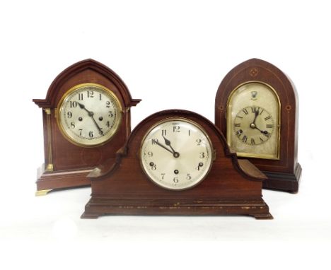 Mahogany Napoleon hat style three train mantel clock striking on eight rods, 9.25" high; also two other wooden cased two trai