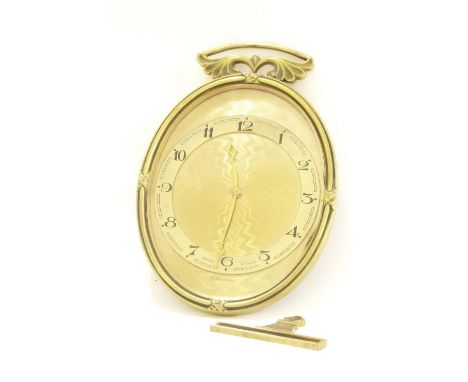 Bucherer boudoir eight day timepiece, the 3.25" chapter ring upon an engine turned dial plate and within an oval surround wit