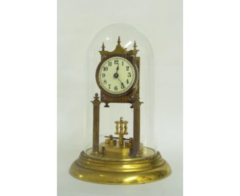 Torsion four hundred day mantel clock, the 2.5" circular dial within a brass case supported by two brass pillars upon a stepp