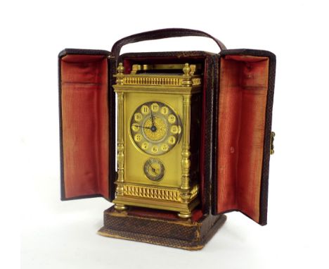 Carriage clock with alarm striking on a bell, the 2" silvered chapter ring above a subsidiary silvered alarm chapter ring wit