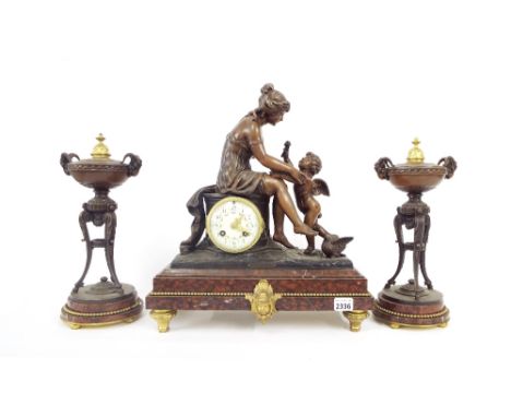 Rouge marble and spelter two train figural mantel clock garniture, the movement with outside countwheel striking on a bell, t