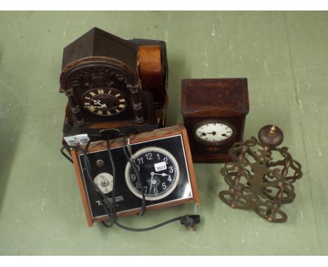 Pierced skeleton clock frame; together with three various wooden mantel clocks and a Techron electric slave clock (5)