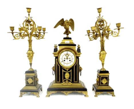 French black marble and ormolu mounted two train mantel clock garniture, the movement with outside countwheel striking on a b