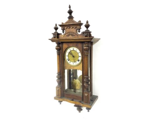 Walnut Vienna two train wall clock, the 5" cream chapter ring enclosing an engine turned centre, within a pillared glazed cas