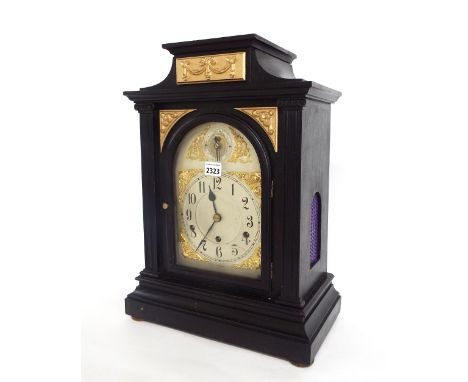 Large German ebonised three train mantel clock striking on five rods, the 7.5" silvered arched dial with chime/silent subsidi