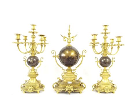 Ormolu and bronze two train mantel clock garniture, the 5" globular dial upon a bronze cast stepped base surmounted by a cast