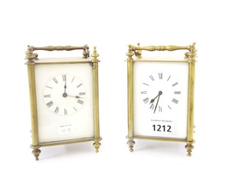 Brass carriage clock with unusual patent winding mechanism, 6.25" high; also another brass carriage timepiece, 6.25" high (2)