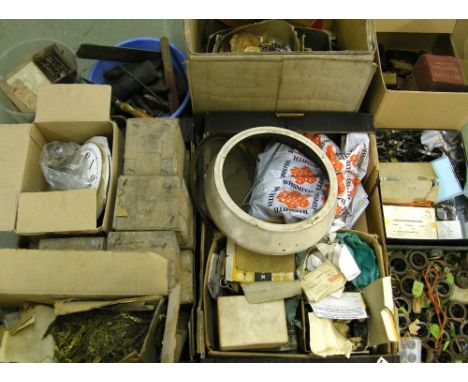 Large quantity of assorted clockmaker's spares, to include mainsprings, dial numerals, weights, tools, travel clocks etc