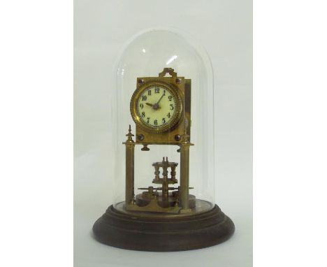 Torsion four hundred day mantel clock, the 2.25" dial within a brass case upon pillars and circular blackened metal stepped b