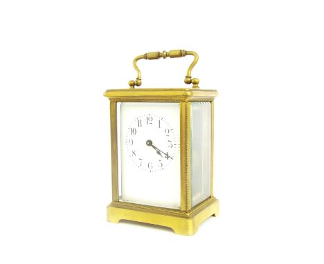 Carriage clock timepiece, within a beaded corniche brass case, 5.5" high, within an outer travelling case