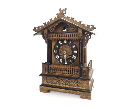 Black Forest two train mantel cuckoo clock (one train fusee), the 6.5" dial within a gabled case with pierced galleries unite