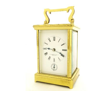 Brass carriage clock with alarm and striking on a gong, the dial signed J.W. Cassidy & Sons Limited, Worcester with subsidiar