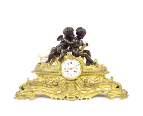 Bronze and ormolu figural two train mantel clock, the movement with outside countwheel striking on a bell, the 4" dial signed