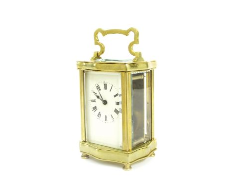 Carriage clock timepiece, within a wavy edge brass case, 6" high