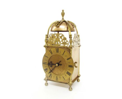 Brass two train lantern clock striking on a bell, the 5" chapter ring enclosing an engraved centre signed Thomas Mudge, surmo
