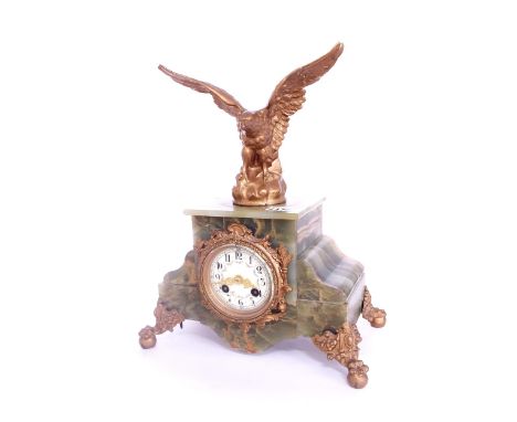 French onyx and gilt metal mounted two train mantel clock striking on a bell, the 3" cream painted dial within a stepped case