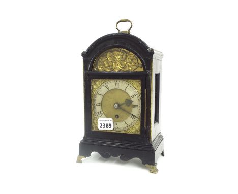 Small ebonised single fusee bracket clock, the 4" brass dial within a rounded arched stepped case surmounted by a brass carry