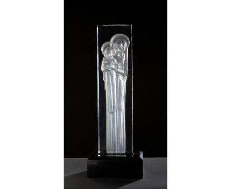 Lalique. France, second half of the 20th century."Virgin and Child".Translucent moulded glass with satin interior. Black resi