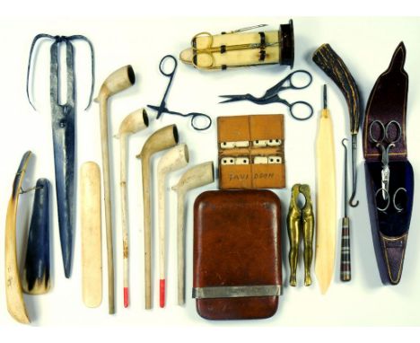 A SILVER MOUNTED TAN LEATHER CIGAR CASE, GILTMETAL MANICURE SET ON LEATHER STAND, FIVE CLAY PIPES, A PAIR OF MIDDLE EASTERN S