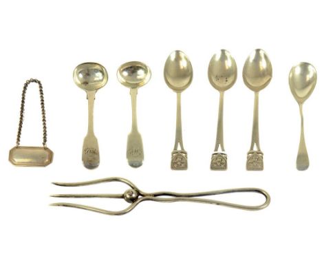 A GEORGE V SILVER BREAD FORK, SHEFFIELD 1922, SIX VARIOUS SILVER TEA OR OTHER SPOONS AND A SILVER BOTTLE LABEL, BIRMINGHAM 19