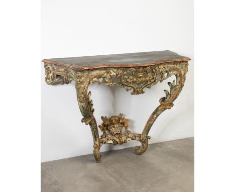 Rococo Consoleabout 1780Rokoko Konsole. Um 1780. Holz, geschnitzt, polychrom gefaßt und vergoldet. Geschwungene Form, durchbr