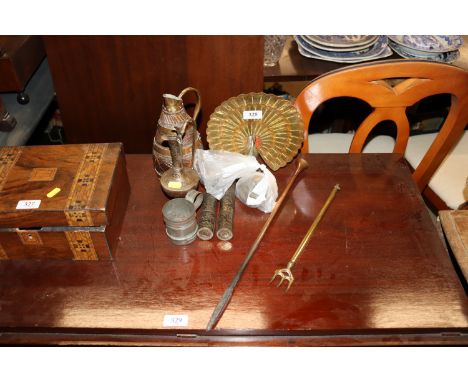 A quantity of brass ware to include toasting fork, ewer, coopered jug, peacock, weights etc.