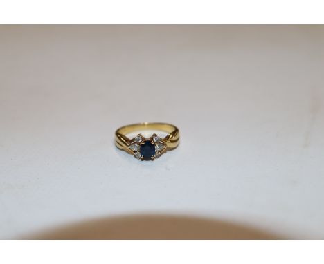 A 18ct gold sapphire and diamond set ring, ring size J/K, approx. total weight 3.5gms 