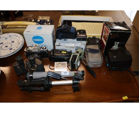 A quantity of various cameras and binoculars to include Minolta, Samsung, Polaroid etc.