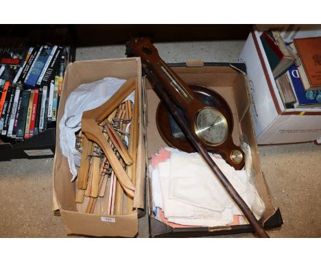 A box containing coat hangers and a box of table napery, walking stick, barometer AF, turned wooden bowl, a cased set of kniv