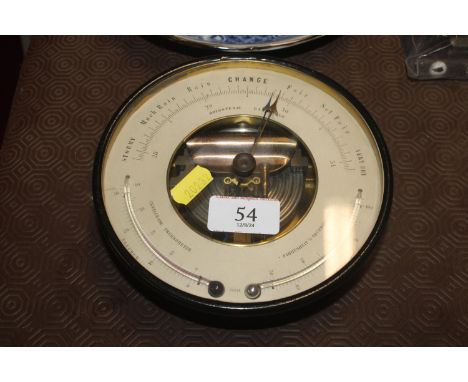 An aneroid barometer in painted metal frame 
