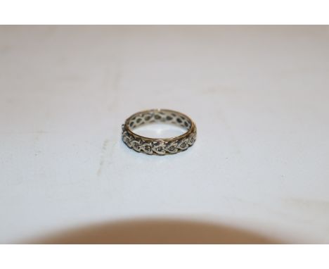A 9ct white and yellow gold eternity ring, set with white stones, ring size O, approx. total weight 2.5gms 
