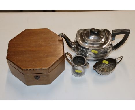 A silver cream jug, approx. 10z (50gms); a silver plated jug, a silver plated tea pot, and a wooden and inlaid trinket box