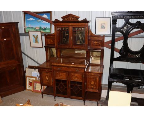 A Victorian rosewood and marquetry inlaid chiffonier, the raised mirrored back having a central display cabinet, drawer and c